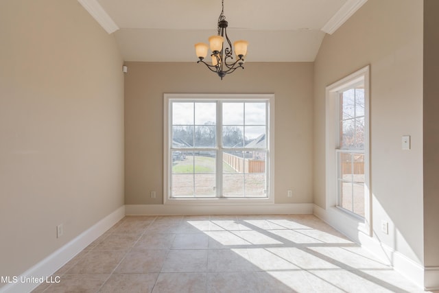 unfurnished dining area featuring an inviting chandelier, light tile patterned floors, ornamental molding, and a healthy amount of sunlight