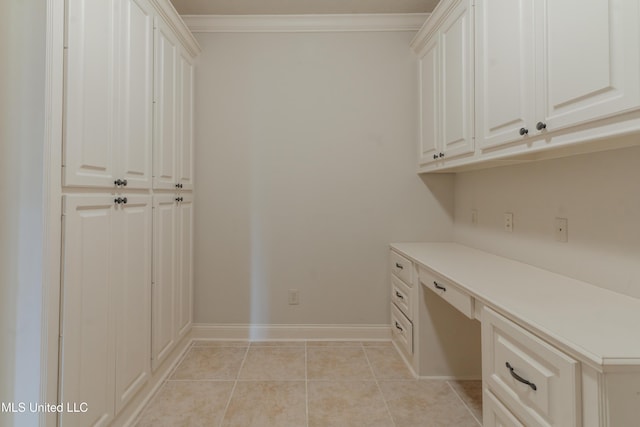 laundry room with ornamental molding and light tile patterned flooring