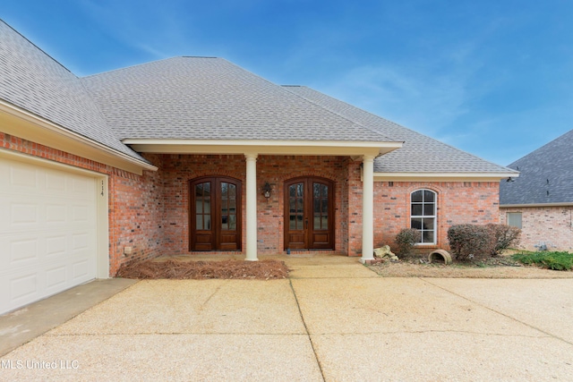 property entrance featuring french doors and a garage