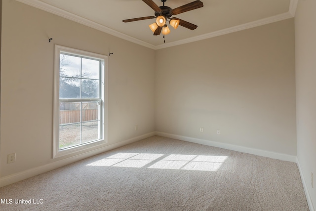 empty room with crown molding, light colored carpet, and ceiling fan