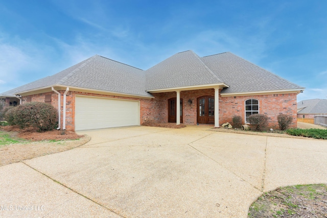 view of front of house featuring french doors and a garage