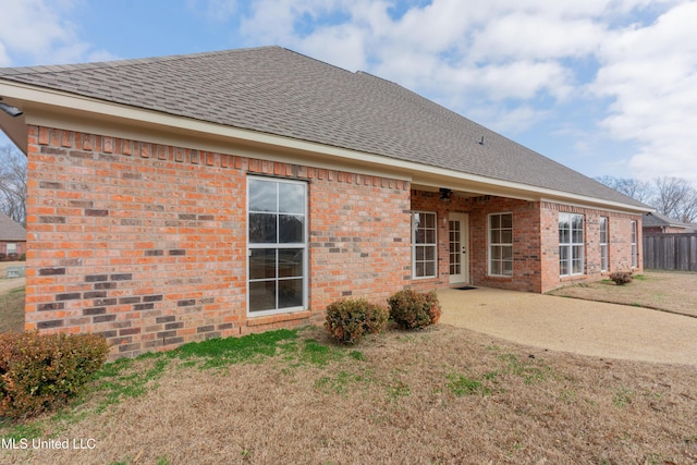 back of house featuring a yard and a patio