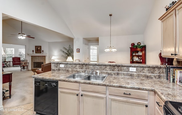 804 Charmant Pl, Ridgeland, MS 39157 - kitchen with black dishwasher, a tiled fireplace, electric range, lofted ceiling, and a ceiling fan