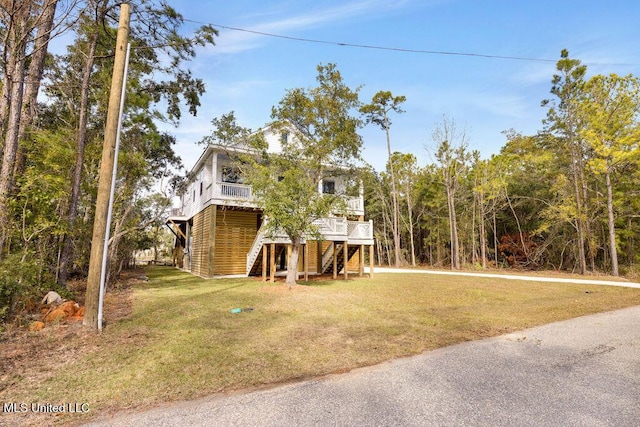 exterior space with a deck and stairs