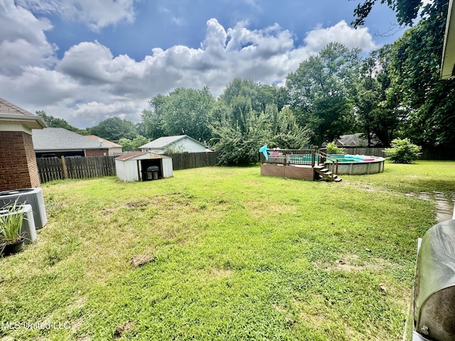 7264 Flower Creek Dr, Southaven, MS 38671 - fenced backyard with a storage unit