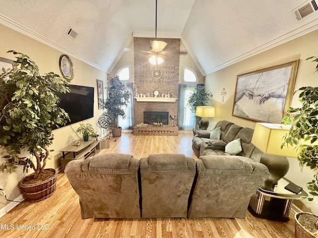 7264 Flower Creek Dr, Southaven, MS 38671 - living room featuring ceiling fan, a fireplace, wood finished floors, and vaulted ceiling
