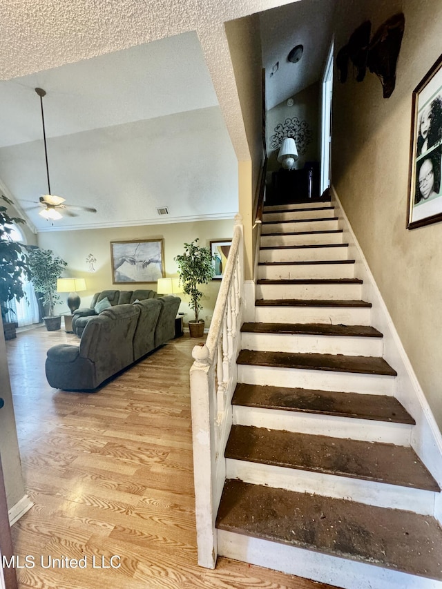 7264 Flower Creek Dr, Southaven, MS 38671 - stairway with ceiling fan, wood finished floors, and ornamental molding