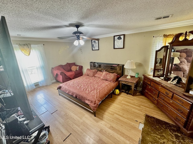 7264 Flower Creek Dr, Southaven, MS 38671 - bedroom featuring ornamental molding, light wood-style floors, a textured ceiling, and ceiling fan