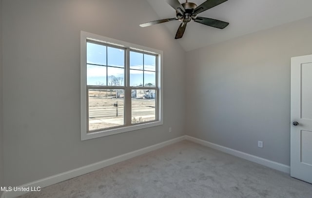 unfurnished room with vaulted ceiling, ceiling fan, and light colored carpet