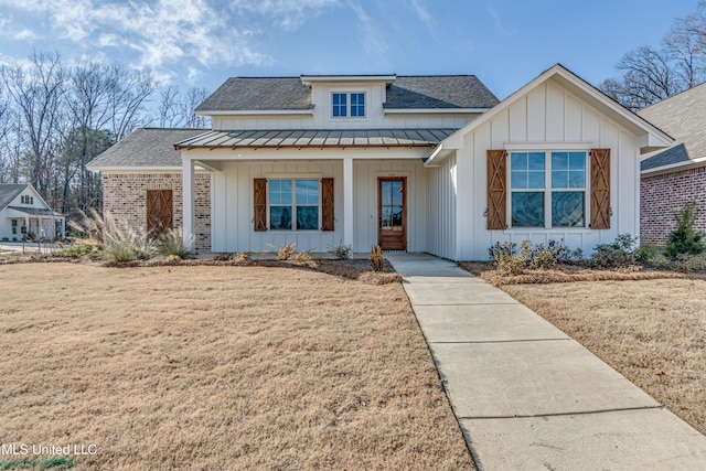 601 Cobalt Way, Brandon, MS 39042 - view of front of house with board and batten siding, a standing seam roof, a porch, and roof with shingles