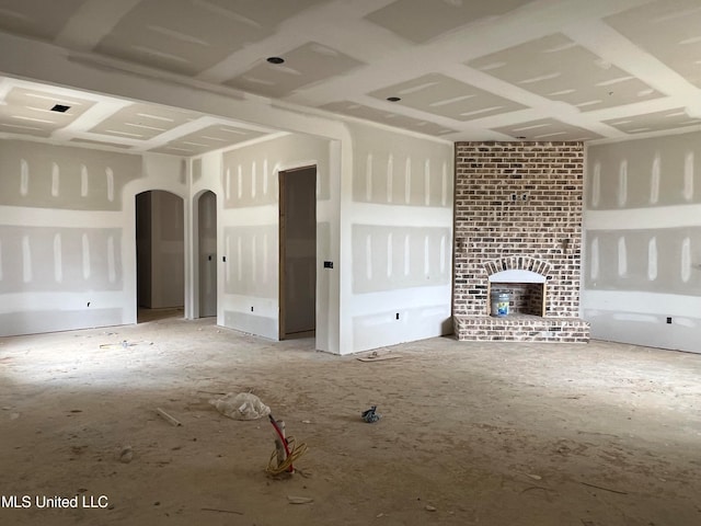 unfurnished living room featuring a fireplace