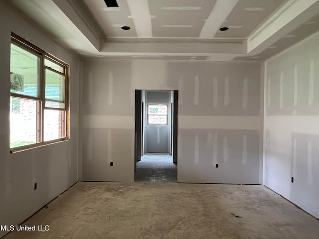 spare room featuring a tray ceiling