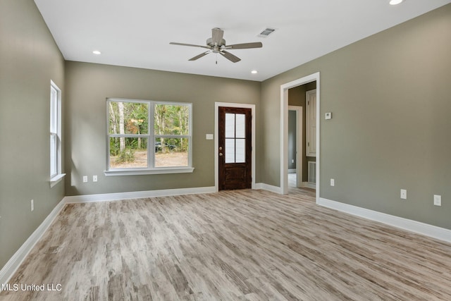 unfurnished living room with recessed lighting, light wood finished floors, baseboards, visible vents, and a ceiling fan