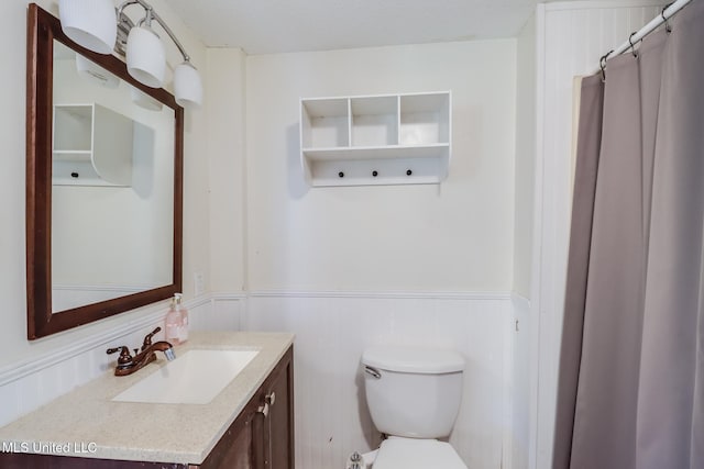 103 Woodlark Cir, Carriere, MS 39426 - bathroom with a wainscoted wall, vanity, and a shower with curtain