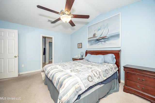 bedroom featuring lofted ceiling, light carpet, and ceiling fan