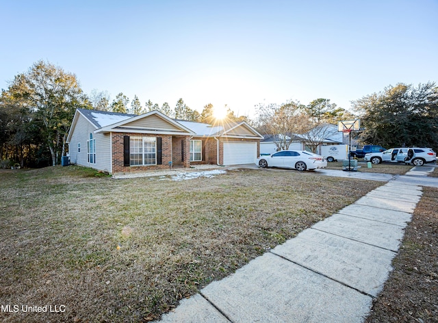 ranch-style home featuring a garage and a front lawn