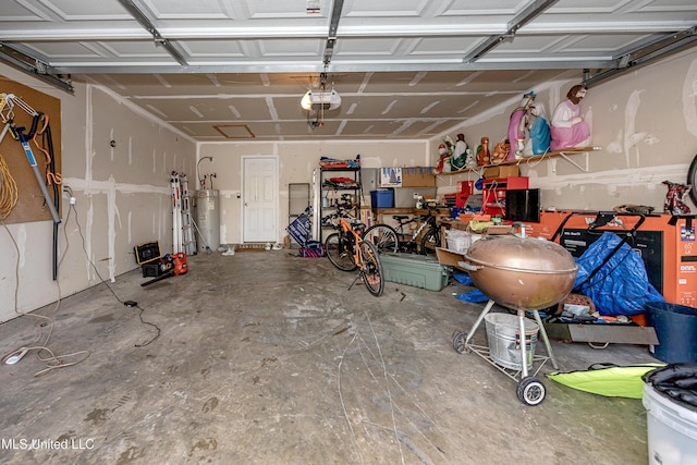 garage featuring a garage door opener and water heater