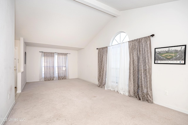 unfurnished room with beamed ceiling, high vaulted ceiling, and light carpet