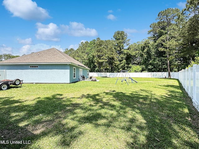 view of yard with a fenced backyard