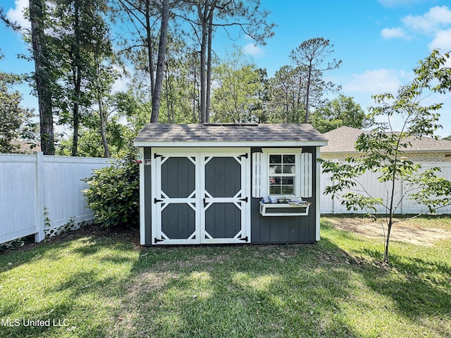 view of shed featuring a fenced backyard