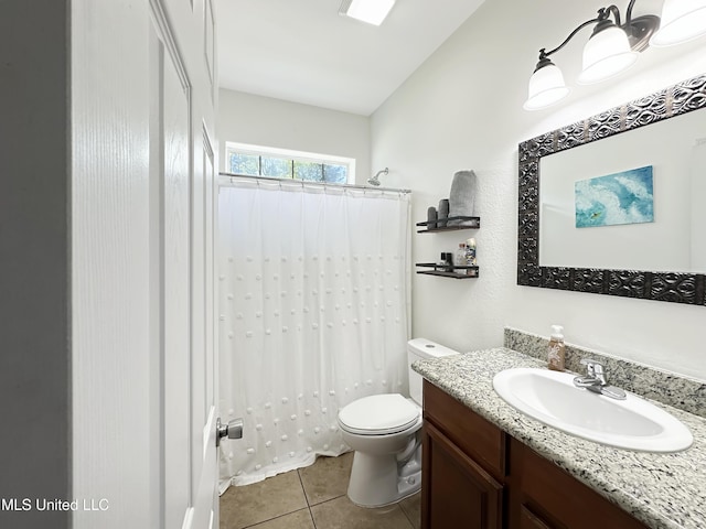 bathroom featuring vanity, tile patterned floors, toilet, and curtained shower