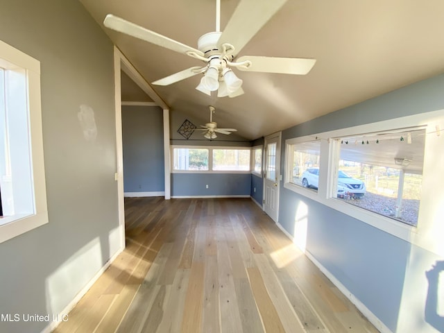 interior space featuring vaulted ceiling and ceiling fan