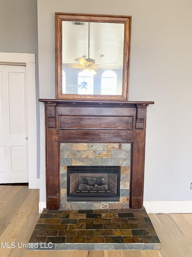 details featuring hardwood / wood-style flooring and ceiling fan
