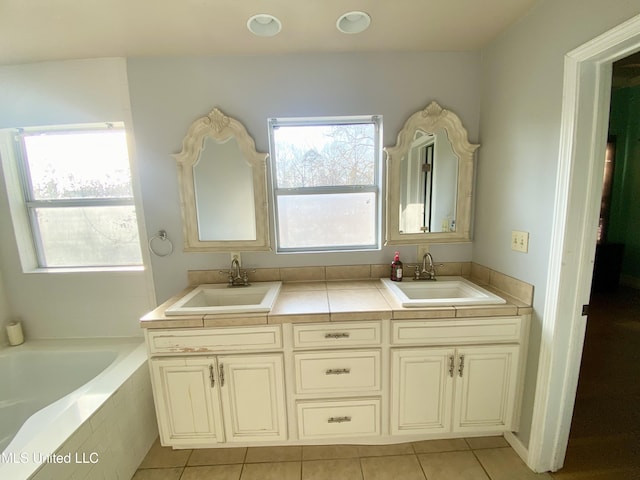 bathroom with vanity, a wealth of natural light, and tile patterned floors