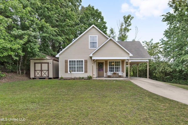 traditional-style house with a storage shed, a carport, driveway, and a front lawn