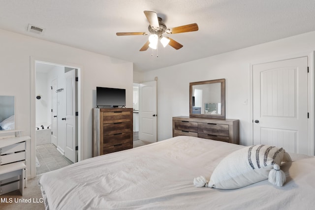 bedroom featuring ensuite bathroom and ceiling fan
