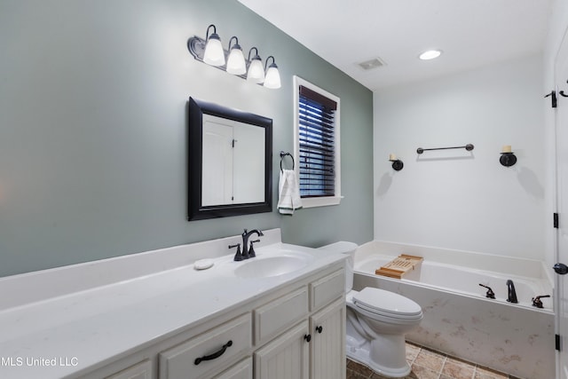full bath with a bath, vanity, and toilet