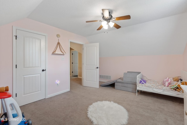 bedroom featuring vaulted ceiling, carpet flooring, a ceiling fan, and baseboards