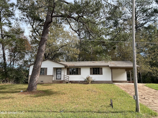 ranch-style home featuring a front yard and a carport