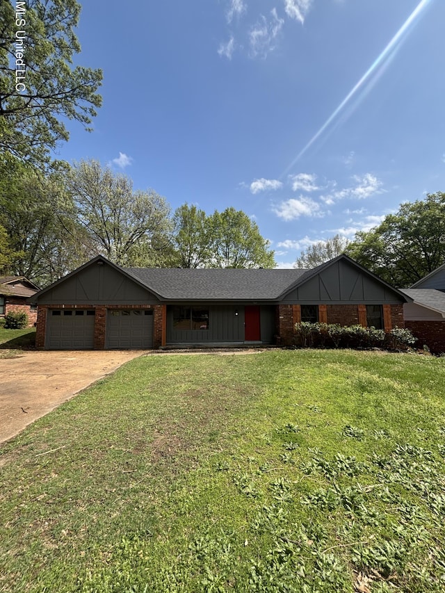 747 Cumberland Cv, Southaven, MS 38671 - ranch-style home featuring brick siding, concrete driveway, a garage, and a front lawn