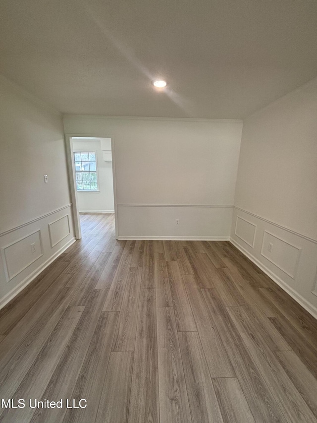 747 Cumberland Cv, Southaven, MS 38671 - empty room with dark wood finished floors and a decorative wall