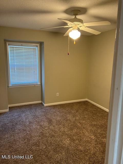 carpeted empty room featuring a textured ceiling and ceiling fan