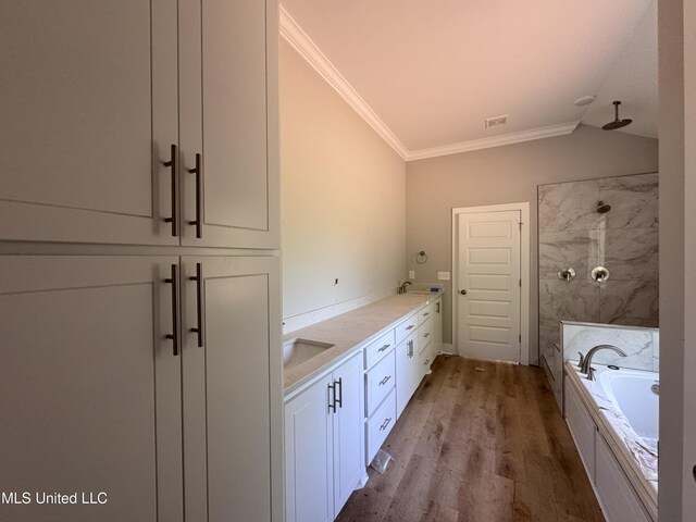 213 Walter Jones Rd, Mendenhall, MS 39114 - full bath featuring crown molding, a washtub, lofted ceiling, a shower, and wood finished floors