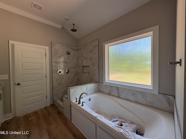 213 Walter Jones Rd, Mendenhall, MS 39114 - full bath featuring a walk in shower, a bath, visible vents, wood finished floors, and lofted ceiling