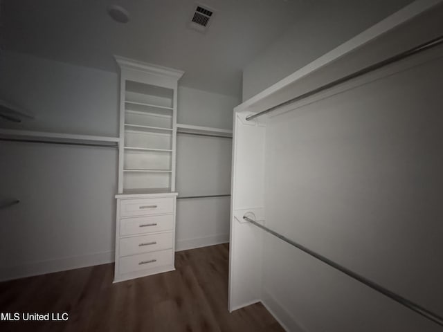 213 Walter Jones Rd, Mendenhall, MS 39114 - walk in closet with visible vents and dark wood finished floors