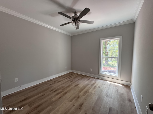 213 Walter Jones Rd, Mendenhall, MS 39114 - spare room with crown molding, wood finished floors, baseboards, and a ceiling fan
