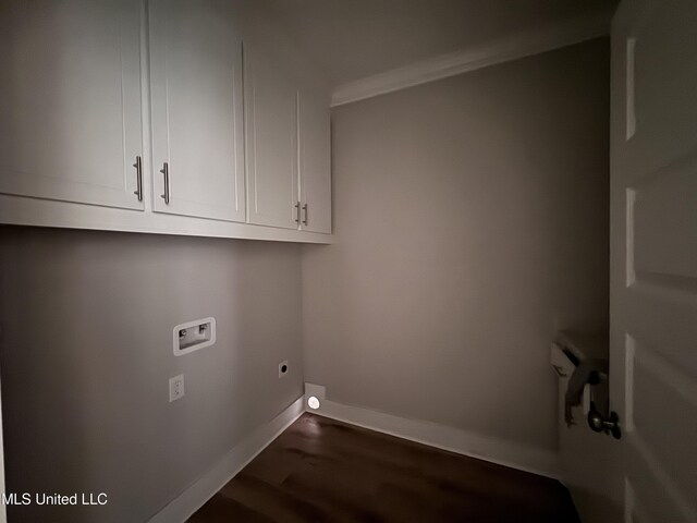 213 Walter Jones Rd, Mendenhall, MS 39114 - laundry room featuring hookup for a washing machine, electric dryer hookup, dark wood-type flooring, baseboards, and cabinet space