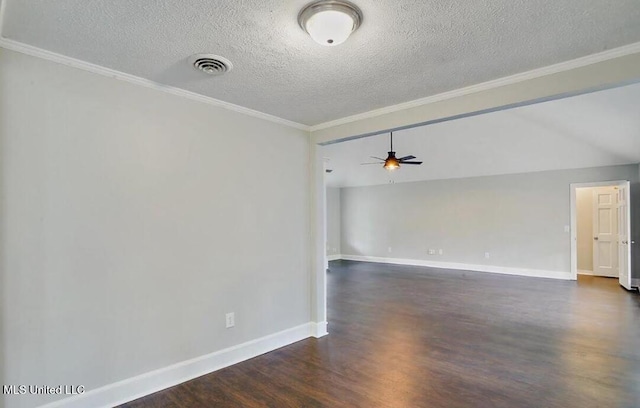 spare room featuring visible vents, baseboards, ornamental molding, a ceiling fan, and dark wood-style flooring