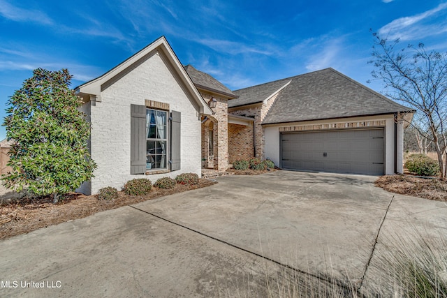 view of front of property with a garage