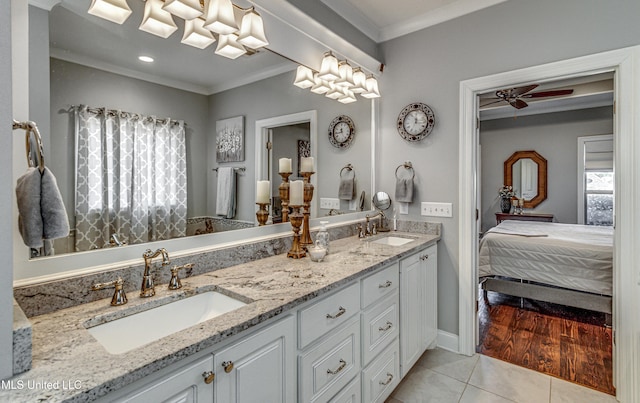 bathroom with ceiling fan, plenty of natural light, crown molding, and tile patterned flooring