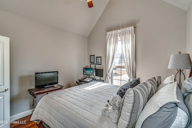 bedroom with vaulted ceiling, ceiling fan, and wood-type flooring