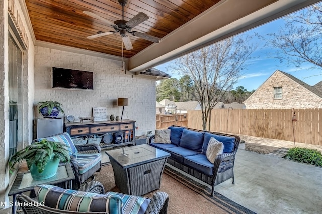 view of patio with ceiling fan and an outdoor living space