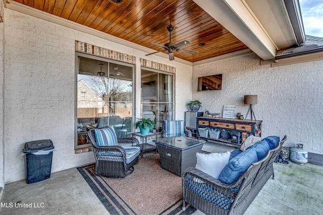 view of patio with ceiling fan and an outdoor living space