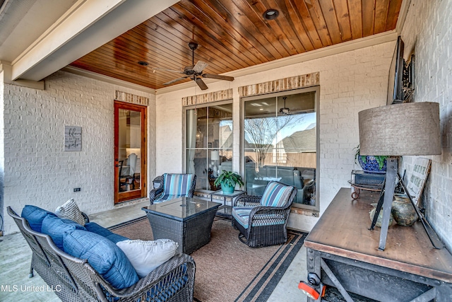 view of patio / terrace with ceiling fan and an outdoor living space