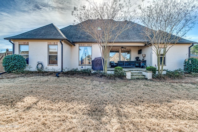 back of house with ceiling fan, a yard, and a patio