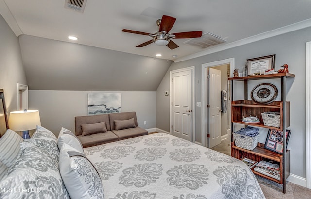 carpeted bedroom featuring ceiling fan, crown molding, and vaulted ceiling